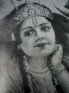 A close view of Sri Krishna's face, head resting on His hand